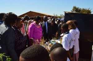 Bambino school students explaining their Permaculture activities to the Director of Malawi's Ministry of Education.