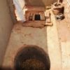 Eco-sanitation--a composting toilet using two 1-meter pits and a movable wooden platform.